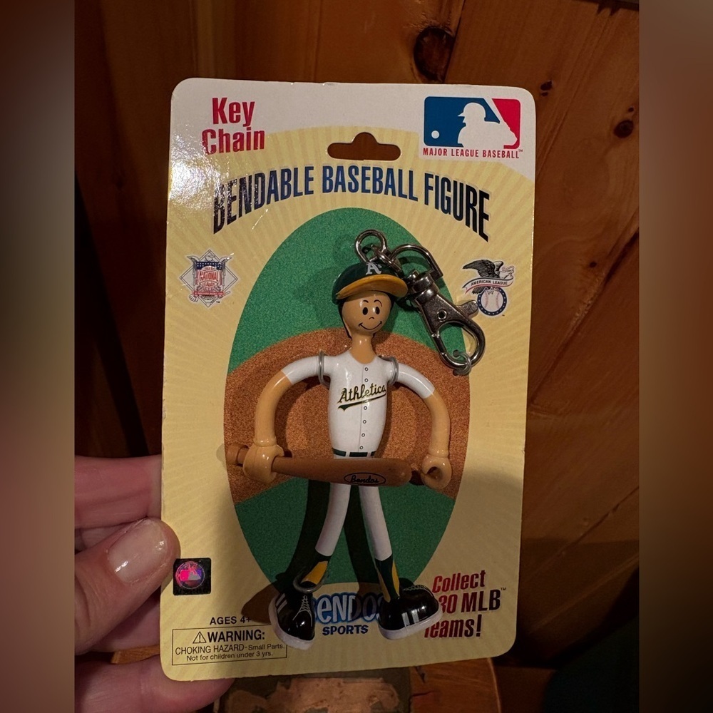vintage Oakland Athletics "Lil' Sports Brat" bendable baseball figure keychain.